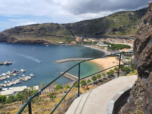 a view of a beach with boats in the water at ParadisMare in Machico