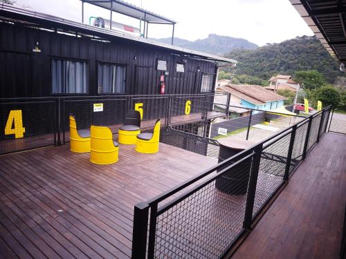 a deck with yellow safety cones on a building at MOTO Inn URUBICI in Urubici