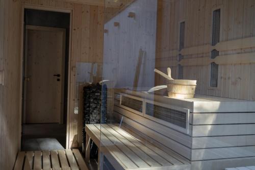 a room with a counter and a wooden wall at Pine chalet in Smižany