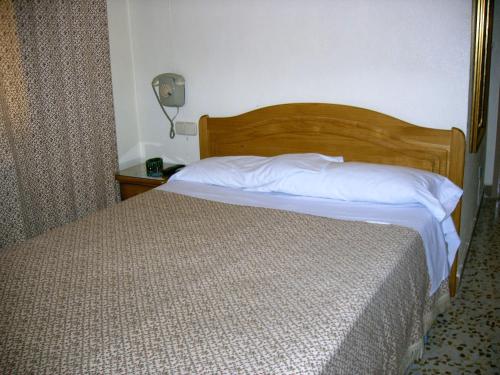 Postel nebo postele na pokoji v ubytování Hotel La Parra