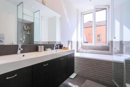 a bathroom with a sink and a mirror and a window at La petite Venise des Alpes, Ultra centre 1 à 5 Pers in Annecy