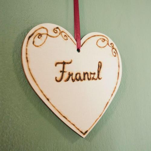 a heart hanging from a string with the word friend at Domizil Ausseerland - Your Austrian Home in Altaussee