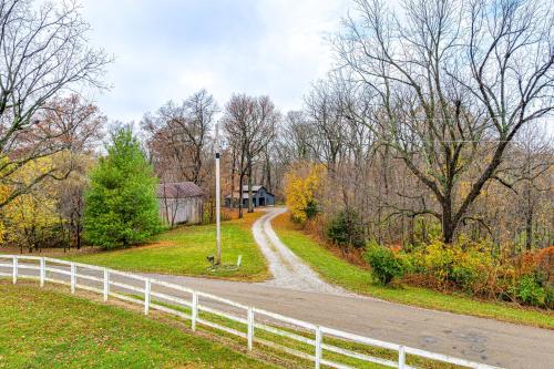 a road with a fence on the side of it at Family-Friendly Milton Home on 14 Acres with Hot Tub in Milton