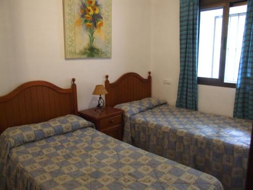 Ένα ή περισσότερα κρεβάτια σε δωμάτιο στο Casa La Rosa P.N. Sierra de Grazalema