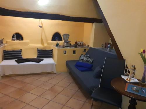 a living room with a couch and a table at Hotel Rural La Raya 1866 in Güimar