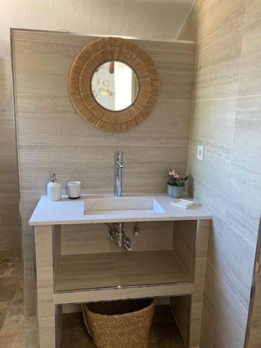 a bathroom with a sink and a mirror at Casa do Monte T2 - Esperança in Arronches