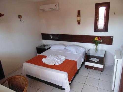 Cama o camas de una habitación en Pousada Solar Ponta Negra