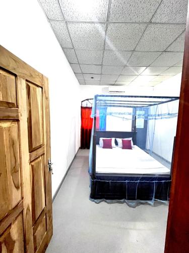 Postel nebo postele na pokoji v ubytování Malsha Villa