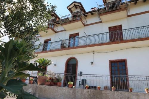 an apartment building with balconies and plants at Il Balcone delle Dee in Agerola