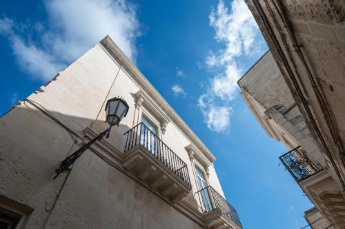 a street light on the side of a building at Il Leccio Verde in Lecce