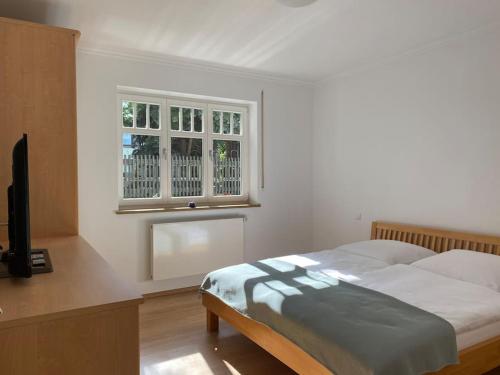 Postel nebo postele na pokoji v ubytování Ferienhaus - Ganzes Haus für Euch allein