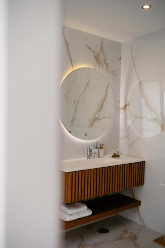 a bathroom with a sink and a mirror at Portugal Alma Villa Algarve - Luxury Villa with Private Pool in Alcantarilha