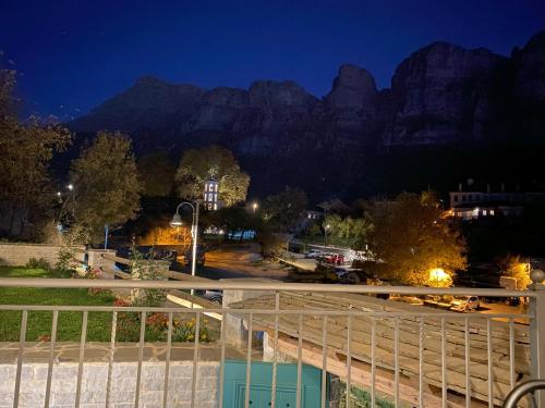 a view of the mountains from a building at night at MAKRIS Papigo Luxury suites in Papigko