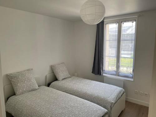 Postel nebo postele na pokoji v ubytování Appartement berges Oise