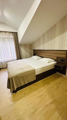 Postel nebo postele na pokoji v ubytování Marrone Hotel Tsaghkadzor