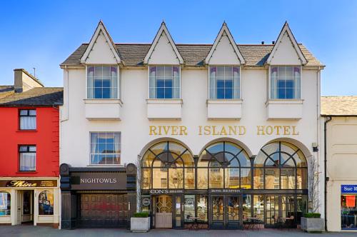a large white building with a river island hotel at River Island Hotel in Castleisland