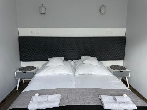 Posteľ alebo postele v izbe v ubytovaní Apartament Lazur