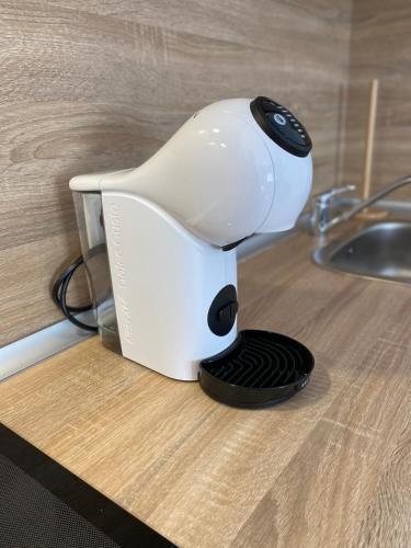 a coffee maker sitting on a counter next to a sink at Playa Honda Red Suite in Playa Honda