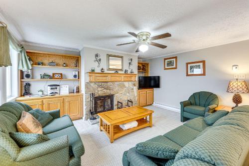 a living room with two couches and a fireplace at Snowshoe Condo with Mtn Views, Walk to Ski Lift in Snowshoe