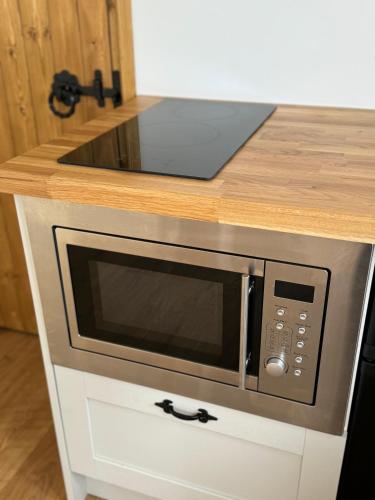 a microwave oven sitting on top of a counter at Meadow in Brixham