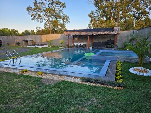 a swimming pool in the yard of a house at Très belle villa avec piscine in Foulpointe