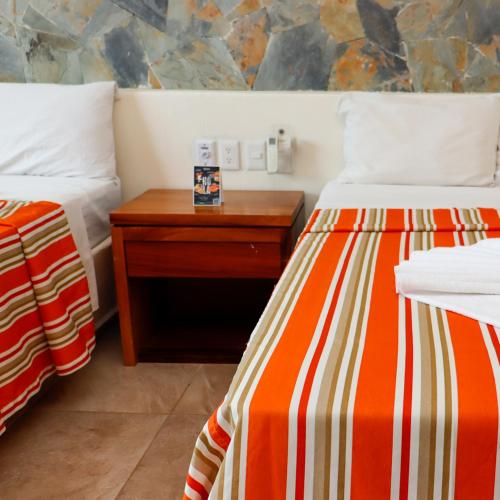 Postel nebo postele na pokoji v ubytování Auroza Resort