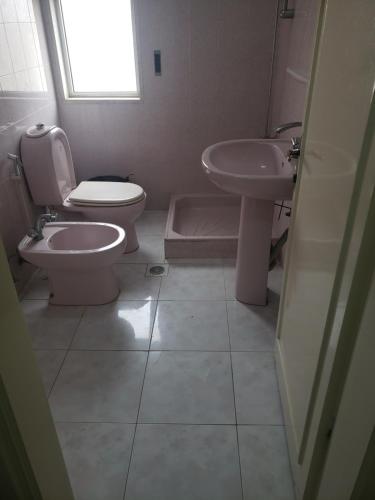 a bathroom with a toilet and a sink at Alotaibi bulding # 6 in Amman