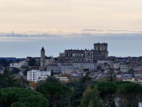 a view of a city with a large building at Appartement calme avec vue in Auch