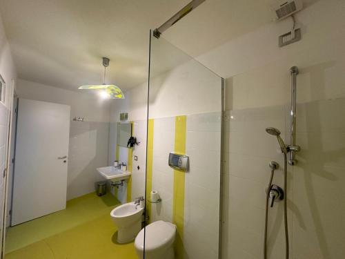 a bathroom with a shower and a toilet and a sink at Il Rifugio delle parole in Nuoro