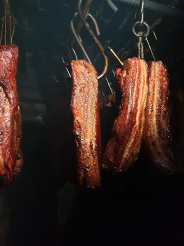 three pieces of meat hanging on a hook at Vila Muntii Bucegi & SPA in Bran