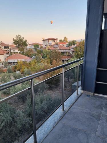 a balcony with a view of a city at Alis Home Pamukkale in Pamukkale