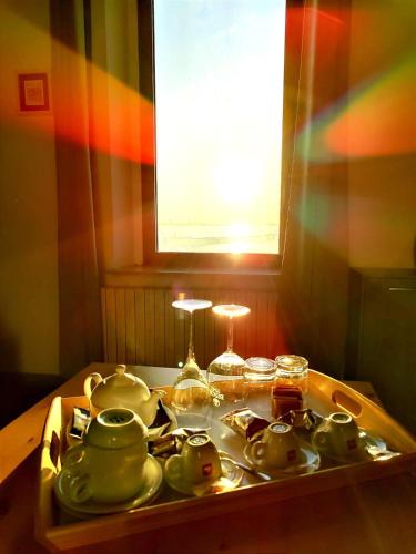 a tea set on a tray on a table at Diomede Rooms - Manfredi Homes&Villas in Manfredonia