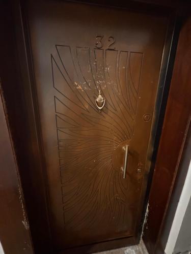 a wooden door with a design on it at Luxury - 2 Bedroom Apartment B7 in Madinaty