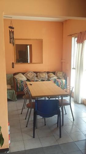 a living room with a table and a couch at Hostal Namaste in Salta