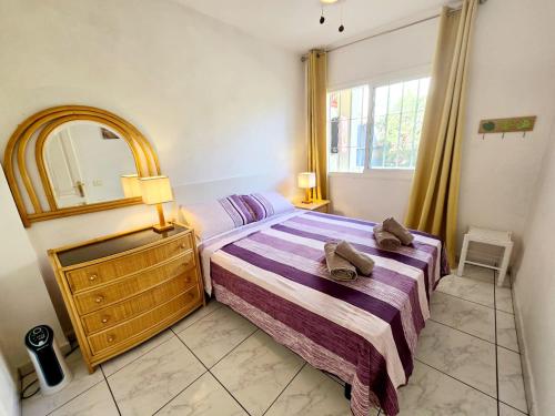 A bed or beds in a room at Los Gigantes Amazing Sea view WiFi Pool Parking