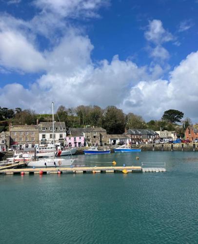 a group of boats docked at a dock in a harbor at Cousins beach house Three bedroom lodge St Minver in Wadebridge