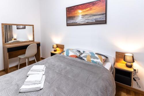Postel nebo postele na pokoji v ubytování Apartman Kolarević