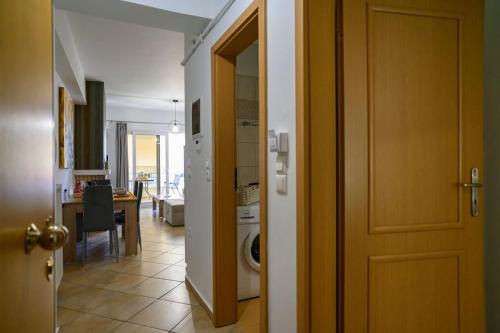a hallway with a door leading to a living room at Premium Athenian District Urban 1 bedroom flat C in Athens