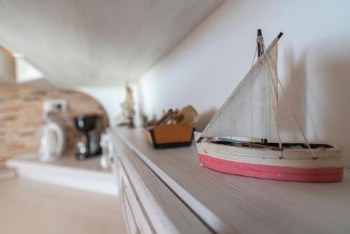 a toy boat sitting on a shelf in a room at Villa Ragusa in Dubrovnik