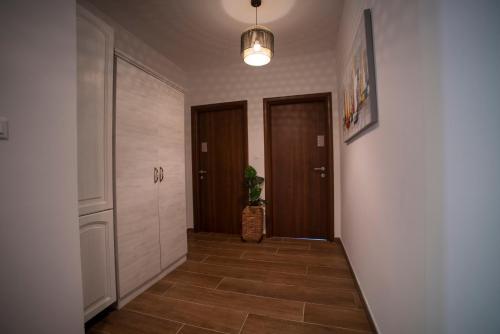 a hallway with a door and a potted plant at Villa Ragusa in Dubrovnik