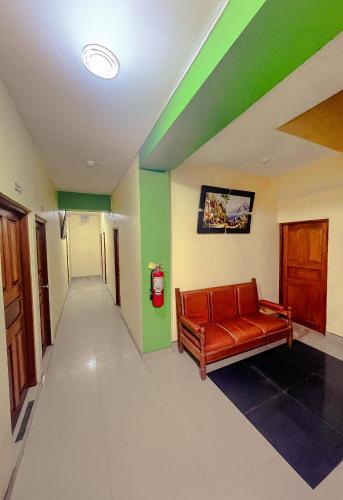 a hallway with a couch in a hospital room at Hospedaje Las Amazonas in Iquitos