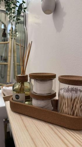 a tray filled with plates and dishes on a table at Appartement cosy et chaleureux avec vue sur nature in Liancourt