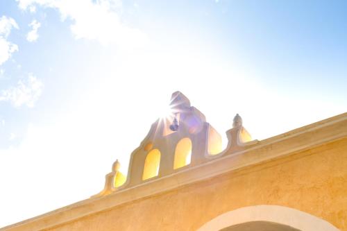 a building with a dome on top of it at Hacienda Cenote San Ignacio in Chocholá
