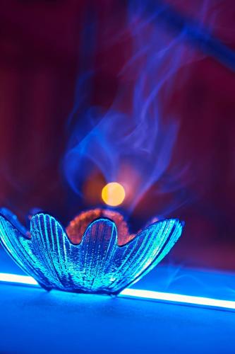 a close up of a blue object with smoke at Aleksandr in Brindisi