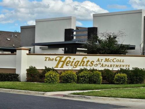 a building with a sign for the lights at meccocal at Heights at Mcoll Luxury Condo #2 in McAllen