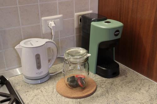 a kitchen counter with a coffee maker and a blender at La Trinità in Bovo