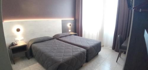 Кровать или кровати в номере Hotel Mistral