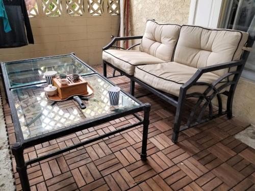 a living room with a couch and a glass table at Bargain Beverly Hills 3 Bedroom in great area 5 minutes to Rodeo Drive in Los Angeles