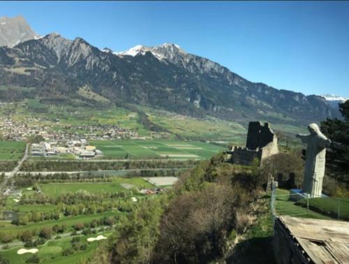a view of a mountain with a statue on a hill at 1 Zimmer Studio mit Kitchenette in Bad Ragaz