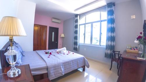 Кровать или кровати в номере Love Phu Quoc